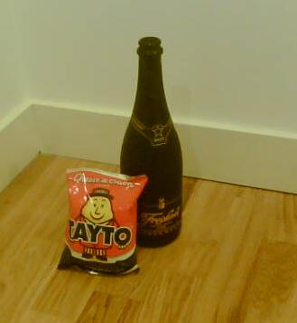 A bottle of Freixenet next to my all time favourite Irish Tayto Crisps (for some reason)